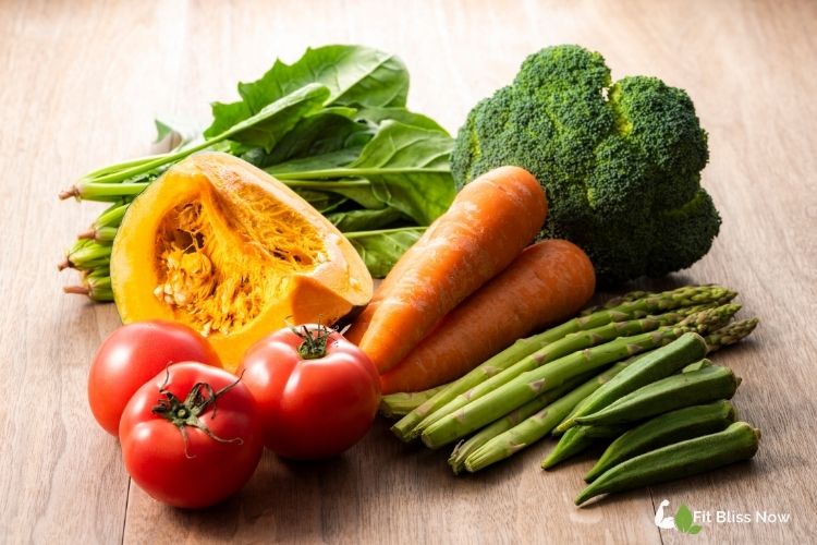 Table with colorful fruits, leafy greens, nuts, and supplements.